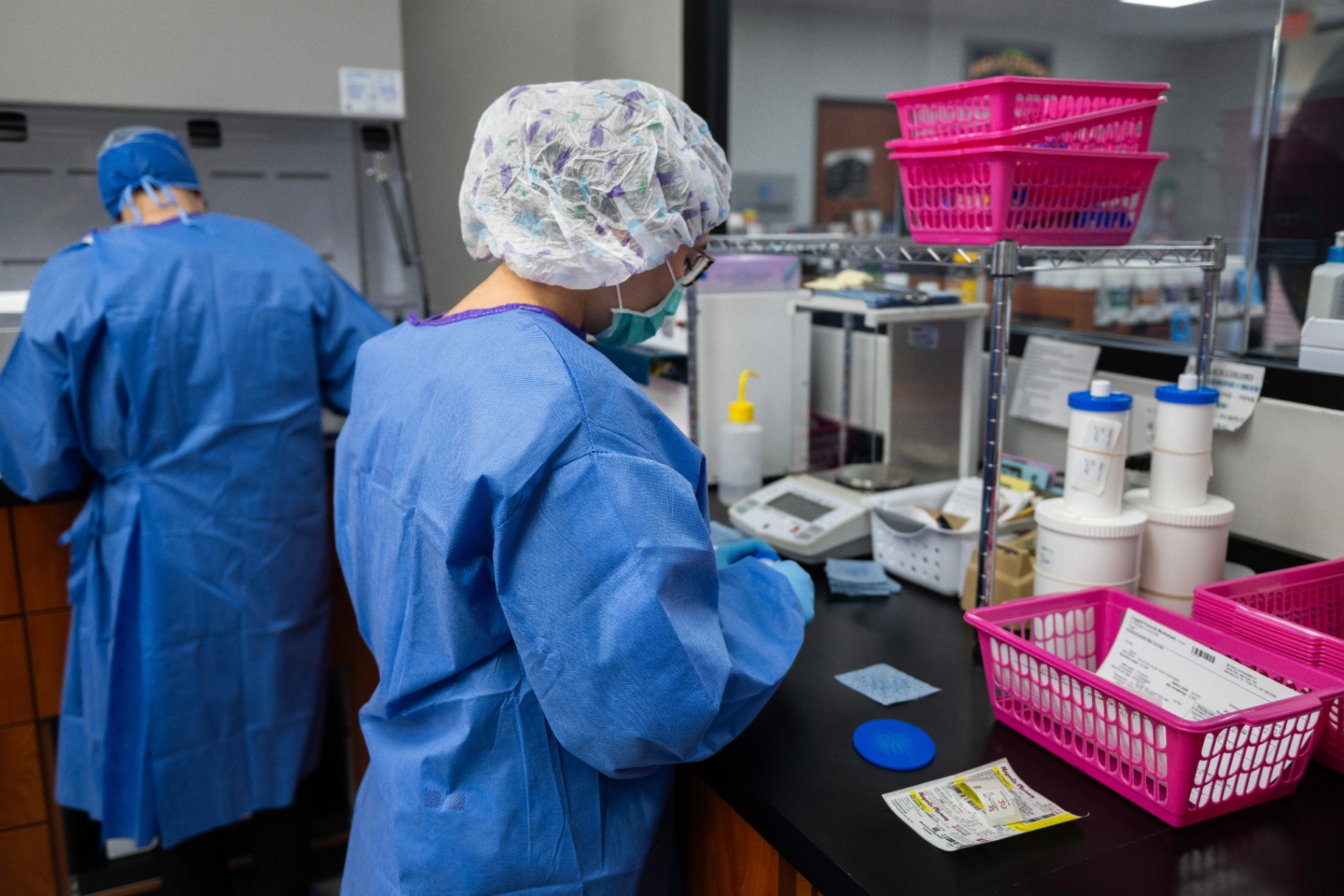 Magnolia pharmacists working side by side at the compounding bench