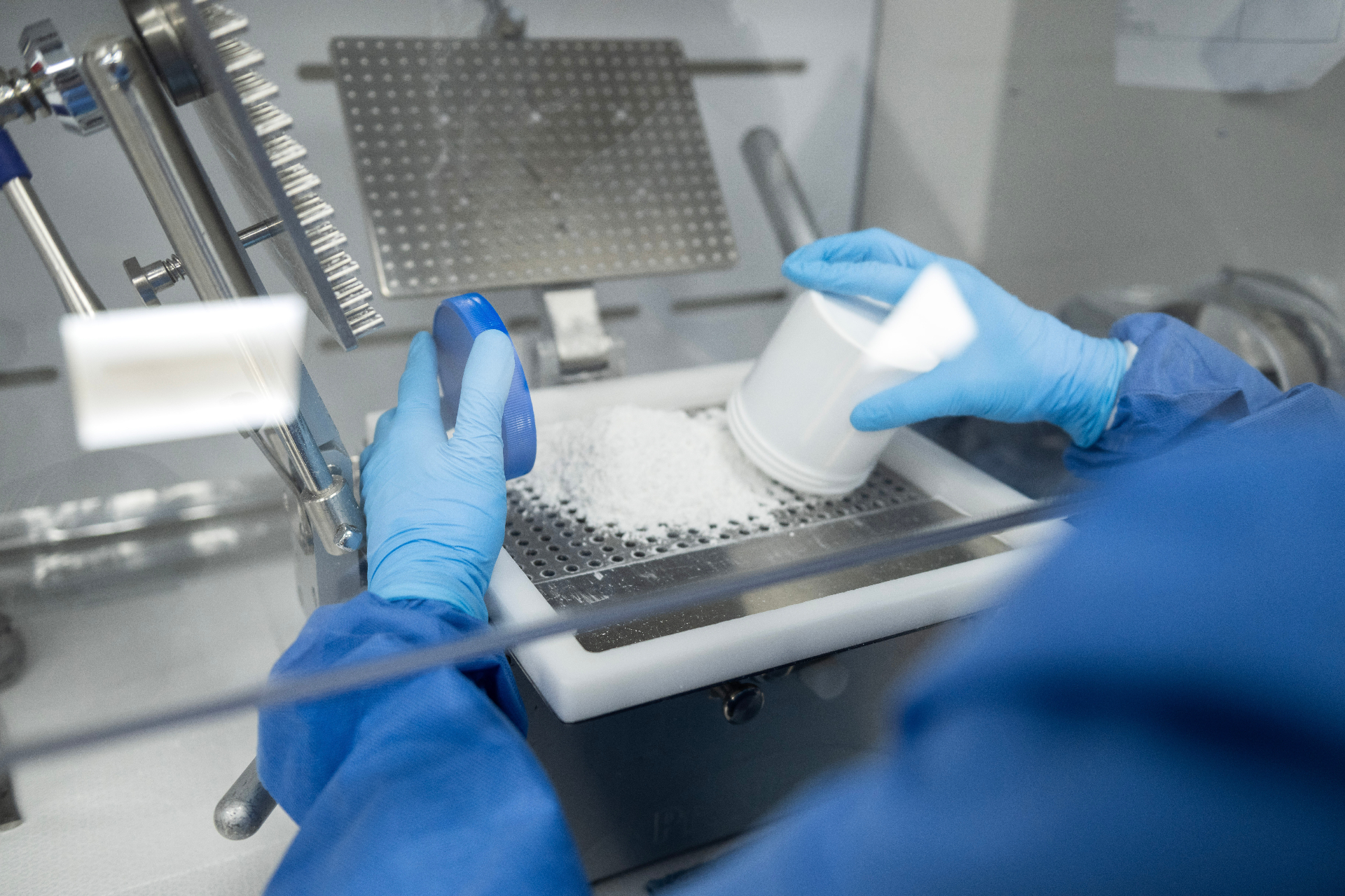 Close-up of a Magnolia pharmacist compounding a custom preparation by hand