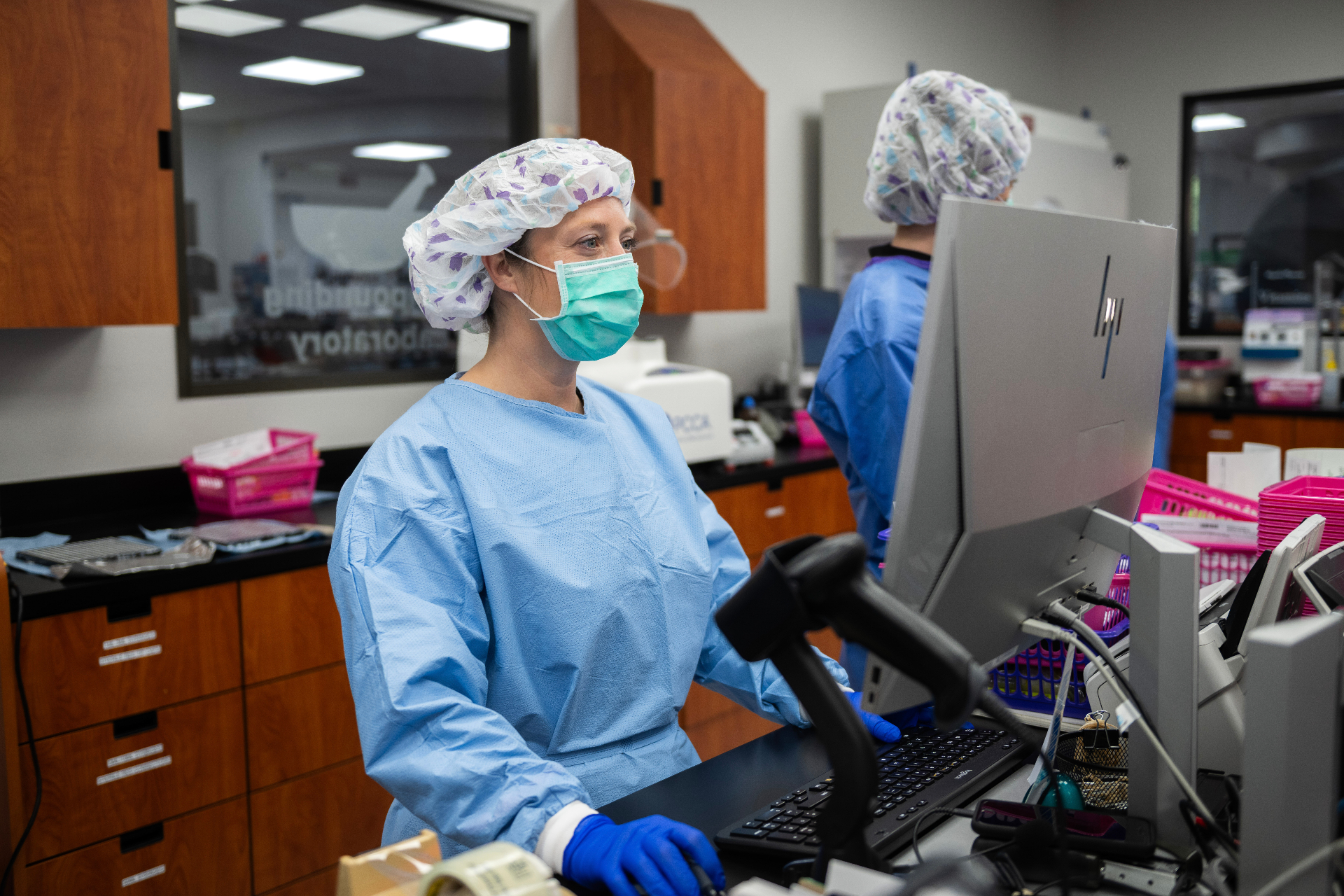 Magnolia pharmacist verifying a prescription at the lab workstation